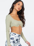 side view of model wearing Princess Polly Rilynn Long Sleeve Top Green 