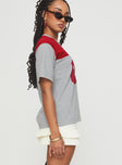 side view of model wearing Princess Polly Balap Top Grey Marle / Red Half Sleeves High Neck 