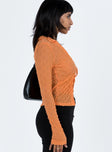 Orange long sleeve top Sheer mesh material  Wide v neckline  Tie front fastening  Good stretch  Unlined 