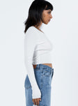 side view of model wearing Princess Polly Shermont Long Sleeve Top Ivory Full Sleeves V-Neck 