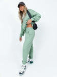 side view of model wearing Princess Polly Club Basic Trackpants Sage 