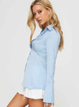 side view of model wearing Princess Polly Southgate Shirt Blue Full Sleeves V-Neck 