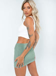   side view of model wearing Princess Polly Courtney Low Waist Mini Skirt Green Mini Skirts 