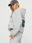 side view of model wearing Princess Polly Princess Polly Hooded Sweatshirt Bubble Text Grey Marle / Slate 