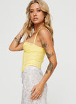 side view of model wearing Princess Polly Luvan Lace Corset Top Yellow Sleeveless Sweetheart 