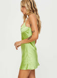 side view of model wearing Princess Polly Merinda Mini Dress Green Scoop Neck 