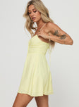 side view of model wearing Princess Polly Tassos Mini Dress Lemon Sweetheart Neckline 