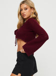 side view of model wearing Princess Polly Rosey Tie Up Long Sleeve Top Burgundy Full Sleeves V-Neck 