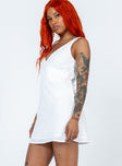 Front view of model wearing  front Princess Polly Asymmetric Neckline  Nellie Mini Dress White