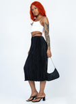   side view of model wearing Princess Polly Blanca Midi Skirt Black Midi Skirts 