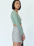   side view of model wearing Princess Polly Ailisha Mini Skirt Green 