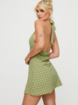 side view of model wearing Princess Polly Kopra Halter Mini Dress Green Plunger 