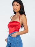 side view of model wearing Princess Polly Marcus Bodysuit Red Sleeveless Square Neck 