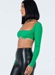 side view of model wearing Princess Polly Becca Long Sleeve Crop Top Green 