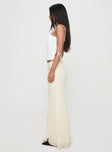   side view of model wearing Princess Polly Incandescent Maxi Skirt Cream Maxi 