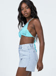 side view of model wearing Princess Polly Leonie Lightwash Denim Shorts High Waisted Shorts 