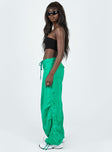 Front view of model wearing  front Princess Polly  Motel Chute Trousers Green