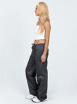 Front view of model wearing  front Princess Polly High Waisted Pants  Harran Parachute Pants Grey