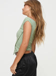 side view of model wearing Princess Polly Karre Off The Shoulder Top Green Sleeveless Asymmetric Neckline 