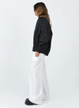 Front view of model wearing  front Princess Polly Low Rise Pants Low Rise Pants High Waisted Pants  The Niel Pants White