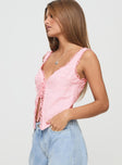 side view of model wearing Princess Polly Merrelle Top Pink Sleeveless Plunger 