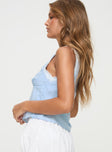 side view of model wearing Princess Polly Tinkerie Top Blue Sleeveless Plunger 