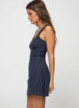 side view of model wearing Princess Polly Dasha Mini Dress Navy Tall Square Neck 