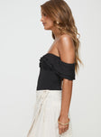 side view of model wearing Princess Polly Coming Back Ruffle Bodysuit Black Short Sleeves 