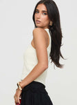 side view of model wearing Princess Polly Robinstone Tank Top White Sleeveless Crew Neck 