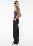 Front view of model wearing  front Princess Polly High Waisted Pants  Fallout Mid Rise Cargo Pants Black Tall