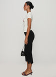 side view of model wearing Princess Polly Mignonette Capri Pant Black High Waisted Pants 