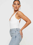 side view of model wearing Princess Polly Nellie Bodysuit White Sleeveless 