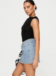   side view of model wearing Princess Polly Nickei Denim Mini Skirt Light Wash Mini Skirts 