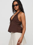 side view of model wearing Princess Polly Gadot Halter Top Brown Sleeveless Plunger 