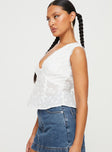 side view of model wearing Princess Polly Gimmie Top White Sleeveless V-Neck 