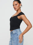 side view of model wearing Princess Polly Gatler Top Black Sleeveless V-Neck 