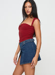   side view of model wearing Princess Polly Wait Up Denim Wrap Mini Skirt Mid Wash Mini Skirts 