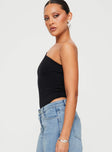 side view of model wearing Princess Polly Seema Bodysuit Black Sleeveless Asymmetric Neckline 