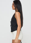 side view of model wearing Princess Polly Awakening Tie Front Top Black Sleeveless Plunger 