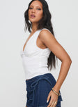 side view of model wearing Princess Polly Hevalis Top White Sleeveless V-Neck 