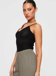 side view of model wearing Princess Polly Going For It Knit Bodysuit Black Sleeveless Scoop Neck 