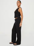 side view of model wearing Princess Polly Zanzibar Pants Black Low Rise Pants 