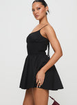 side view of model wearing Princess Polly Matisse Mini Dress Black Scoop Neck 