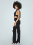 side view of model wearing Princess Polly Motel Tarava Trouser Crepe Hotfix Diamante Black 