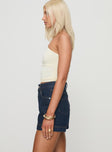 side view of model wearing Princess Polly Heuston Denim Skort Dark Wash High Waisted Shorts 