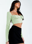 side view of model wearing Princess Polly Geneve Long Sleeve Top Green Full Sleeves Square Neck 