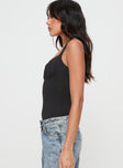 side view of model wearing Princess Polly Peekaboo Bodysuit Black Sleeveless Sweetheart 