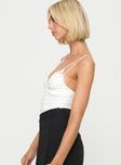 side view of model wearing Princess Polly Corella Bodysuit White Sleeveless 