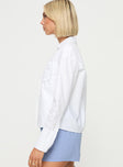 side view of model wearing Princess Polly Kellot Shirt White Full Sleeves V-Neck 