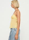 side view of model wearing Princess Polly Zami Pleat Top Lemon Sleeveless Plunger 